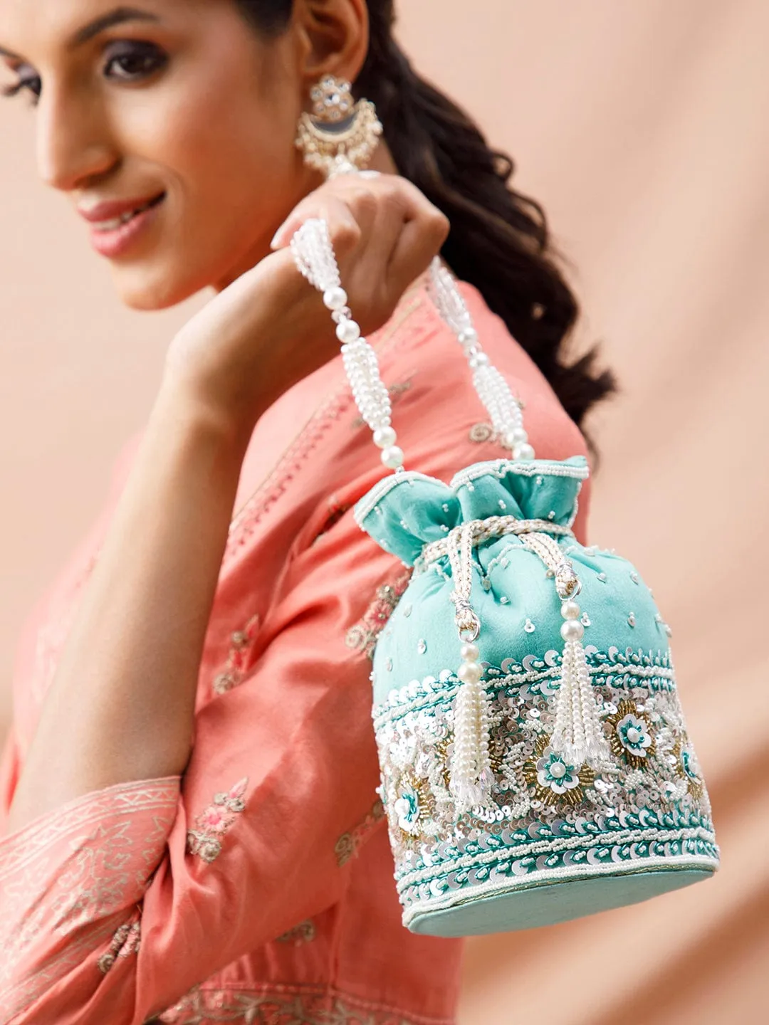 Rubans Mint Coloured Potli Bag With Golden And White Embroided Design.